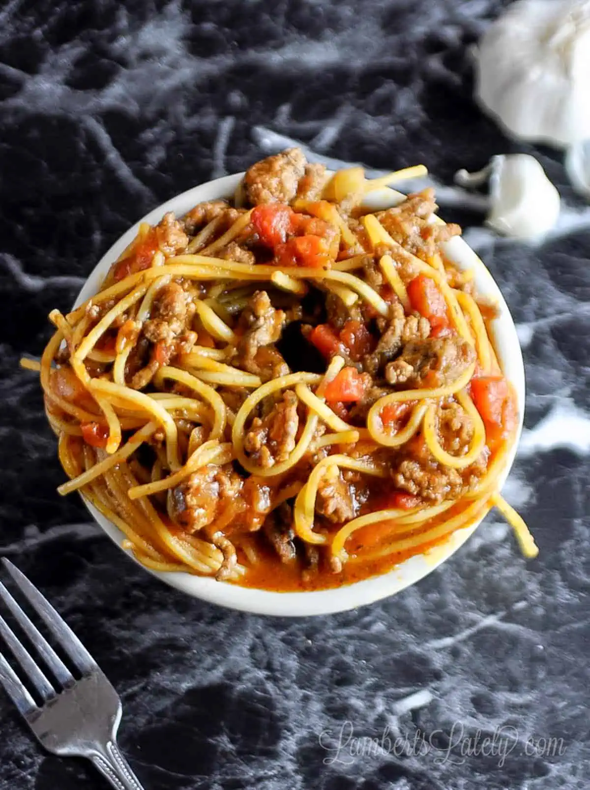 a bowl of spaghetti on a countertop.