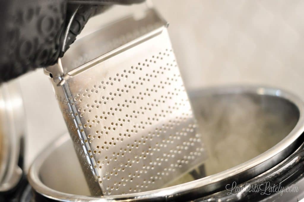 steamer basket lifted out of an instant pot