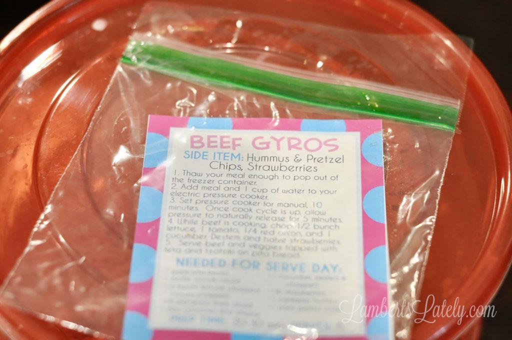 freezer meal label in a plastic bag on top of a freezer container.