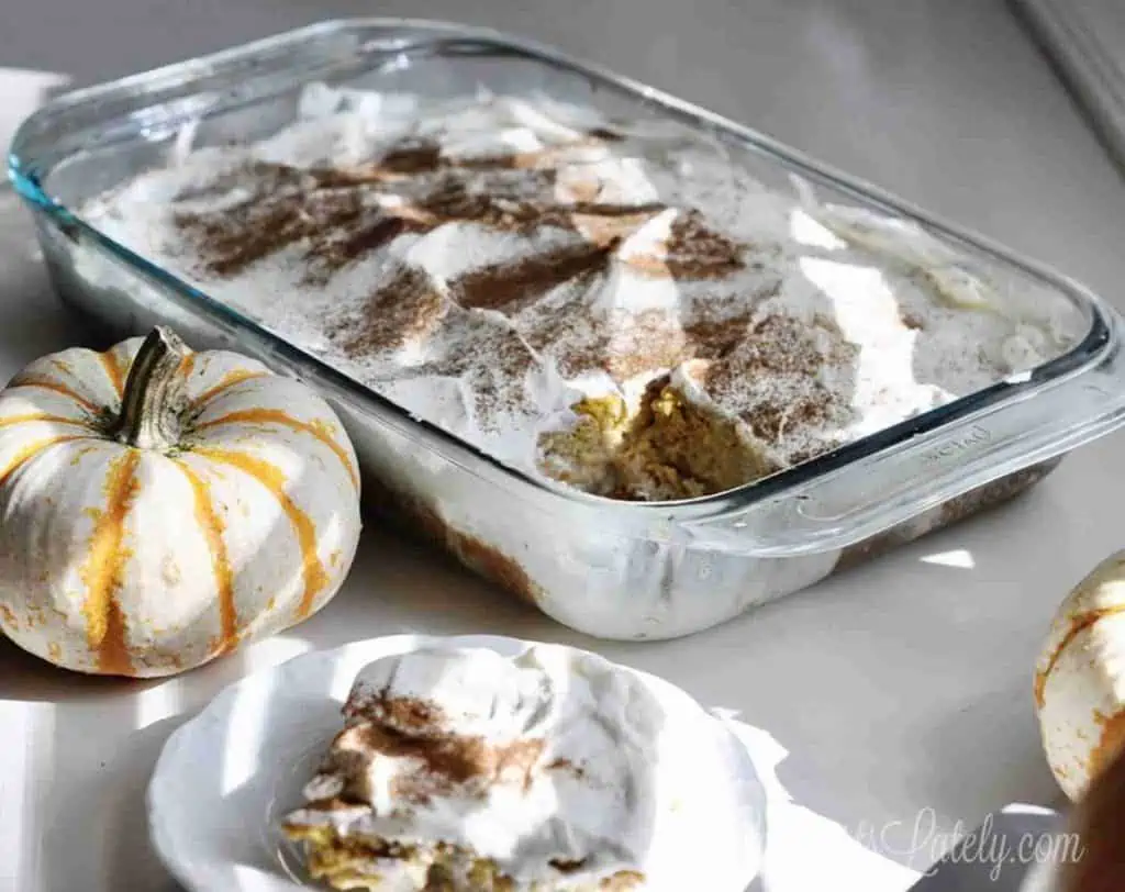 finished pumpkin spice tres leches cake in a pyrex baking dish.