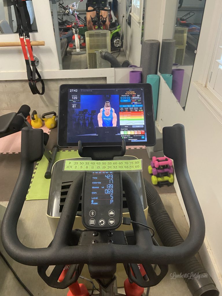 Ipad on a Schwinn IC4 with Peloton app opened.