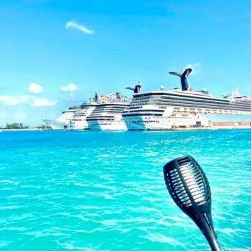 cruise ships lined up in bright blue water.