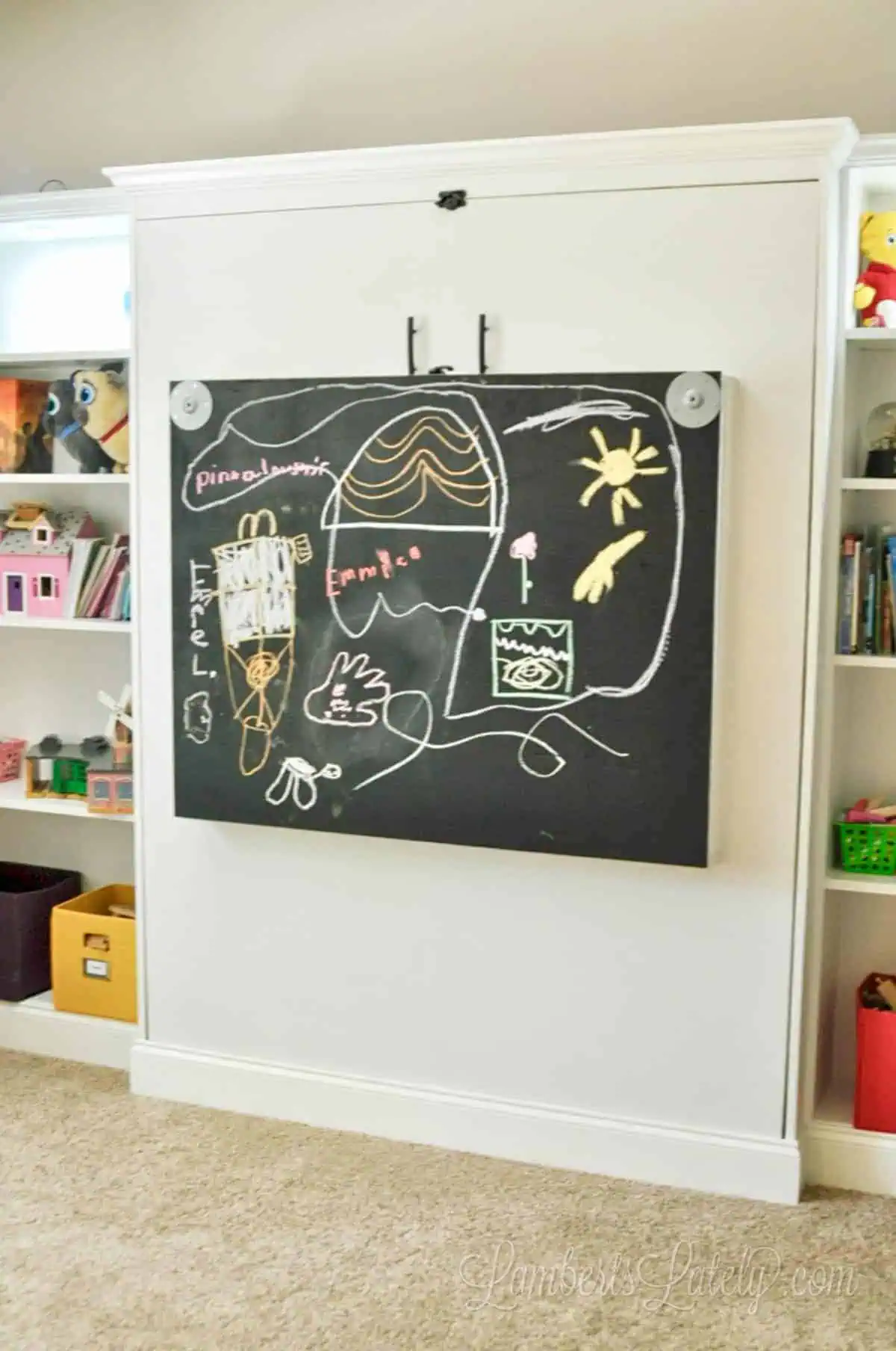 murphy bed desk closed with chalkboard showing.