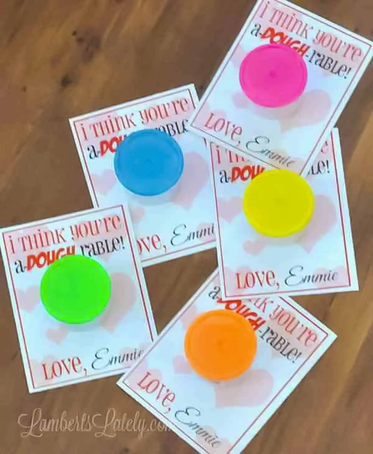 Free Printable Valentines for Play-Doh on a wood table.