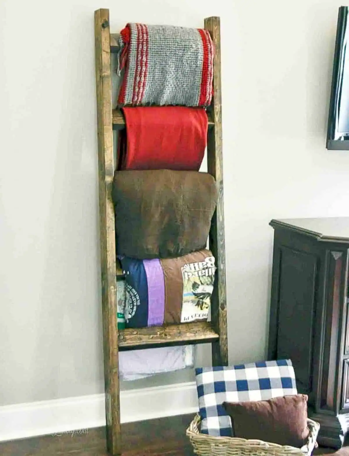 blanket ladder leaning against a wall.