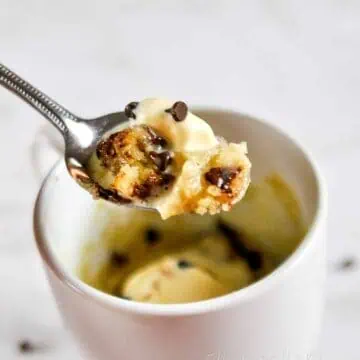 spoon of chocolate chip mug cake and ice cream.