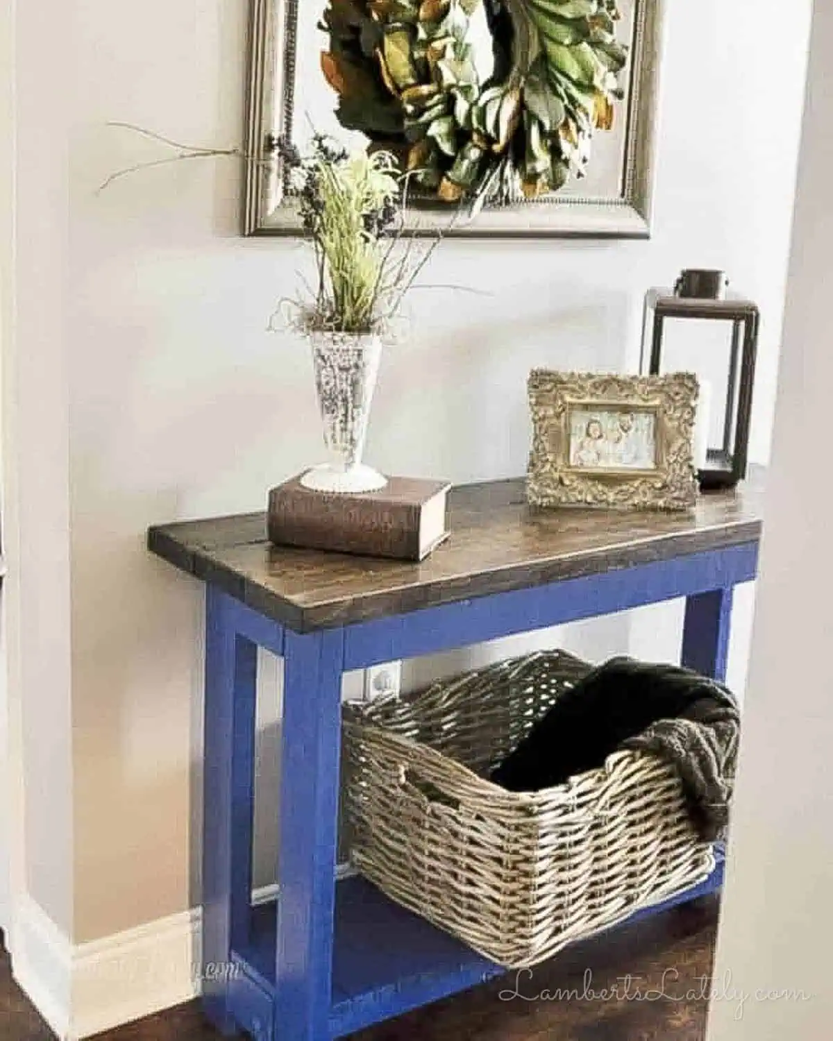 blue and brown diy console table in an entryway.