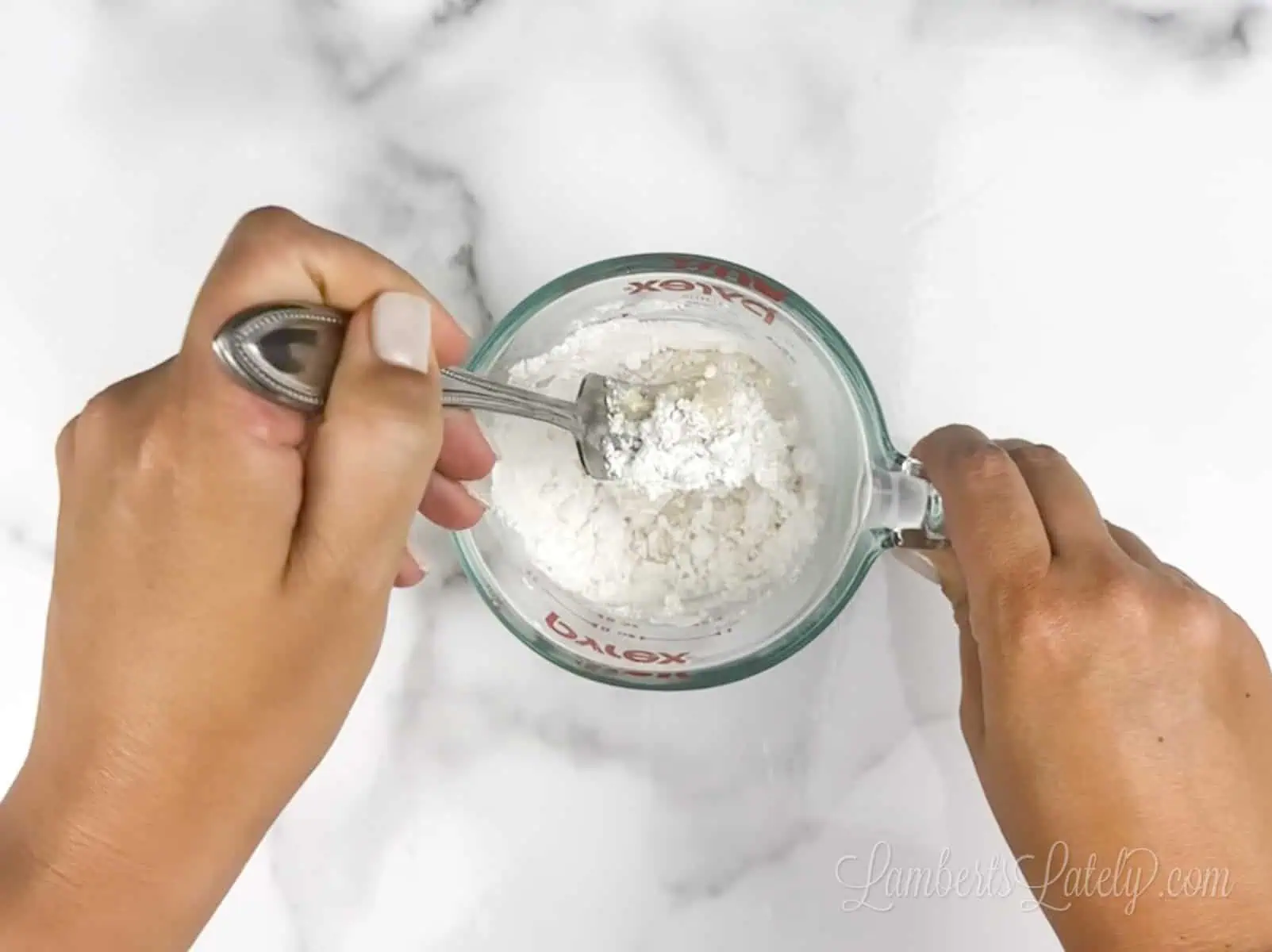 stirring together powdered sugar, half and half, and vanilla extract in a measuring cup.