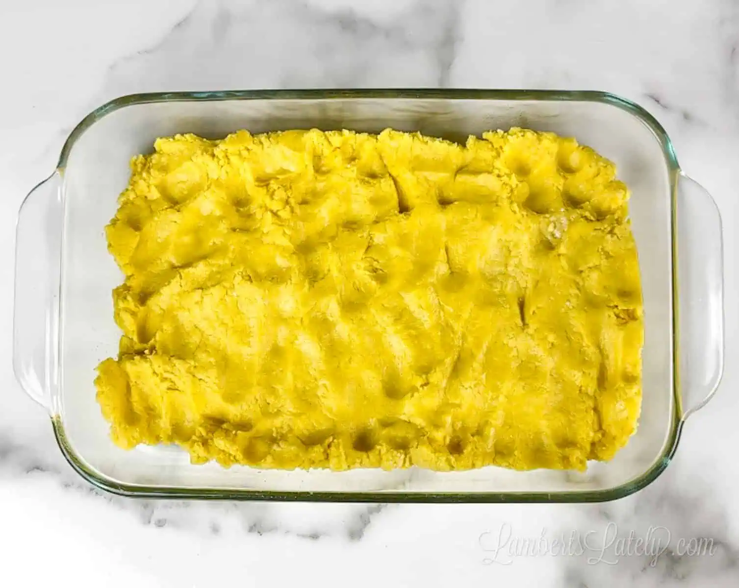 lemon cake mix pressed into bottom of a pyrex dish.