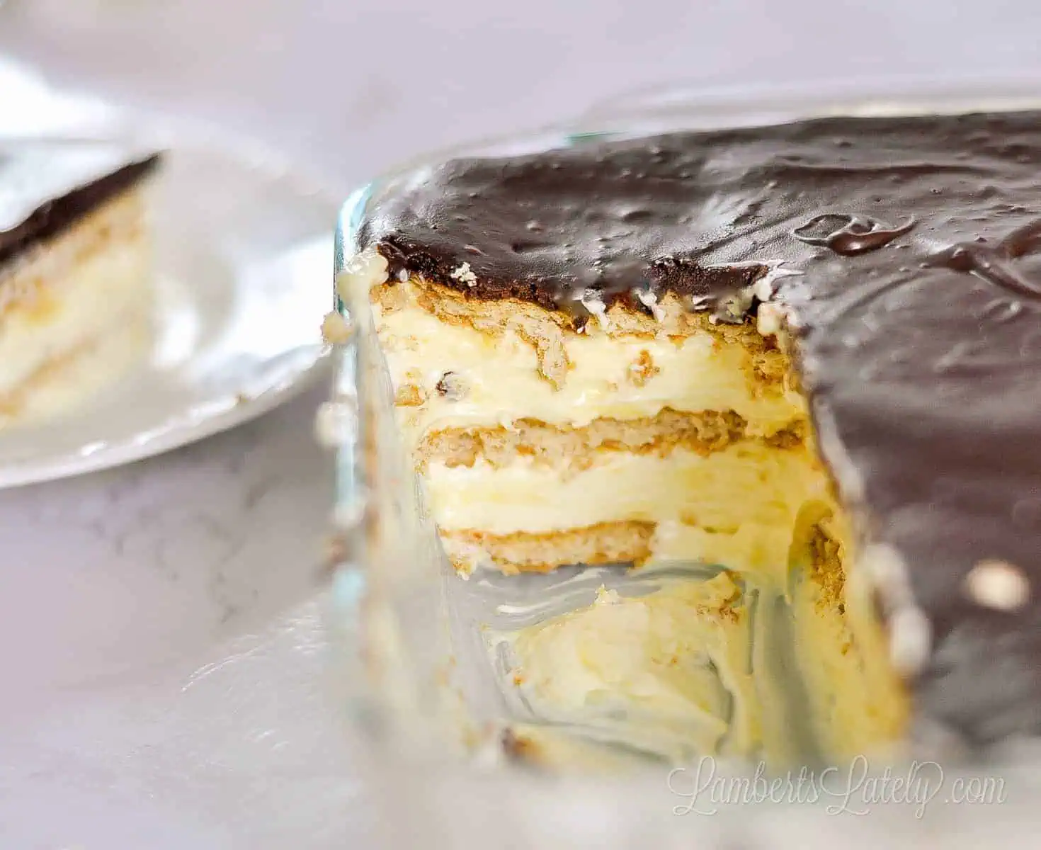 pieces of no bake chocolate eclair cake removed from a baking dish.