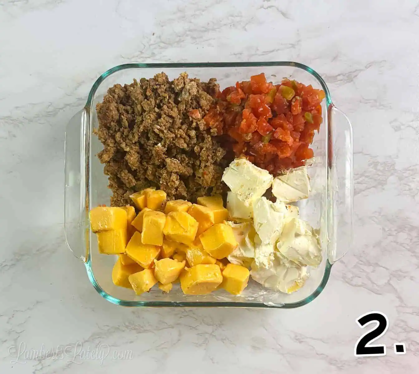 ingredients for rotel dip in a microwave safe glass dish.