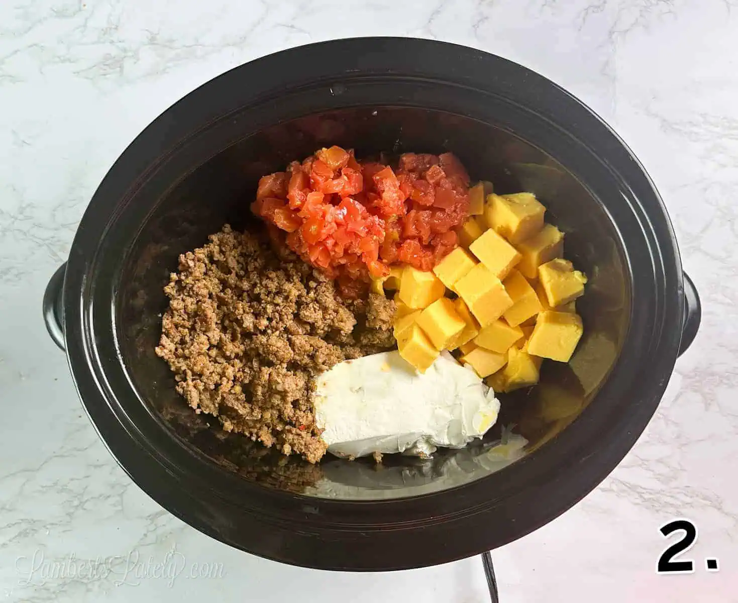 ingredients for rotel dip in a crock pot.