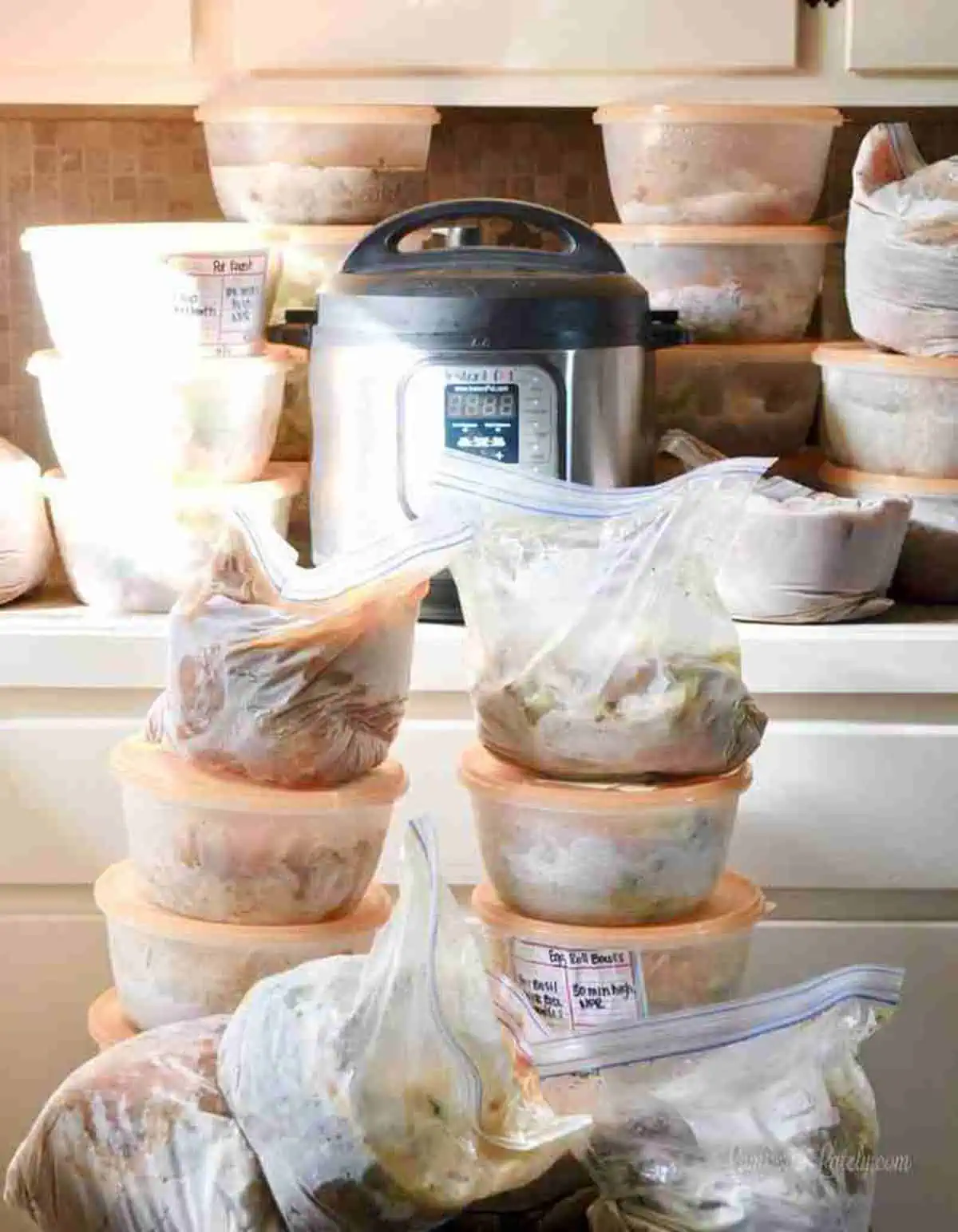 freezer meals stacked around an instant pot.