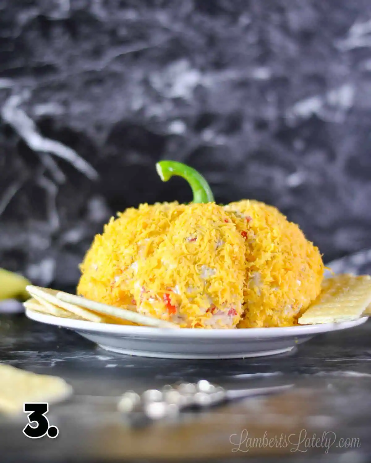 pumpkin cheese ball on a plate.