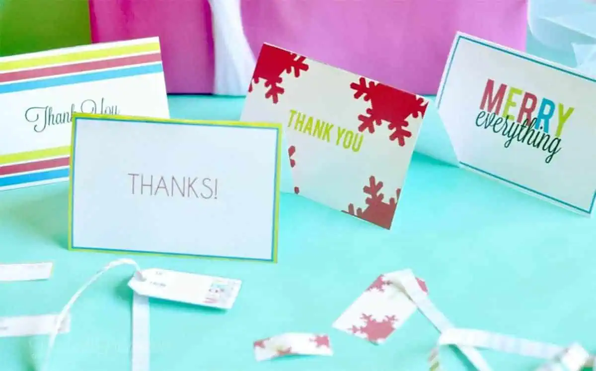 thank you notes spread out with gift tags and ribbon.