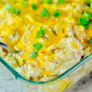 close up of a spoon in the twice baked mashed potatoes.