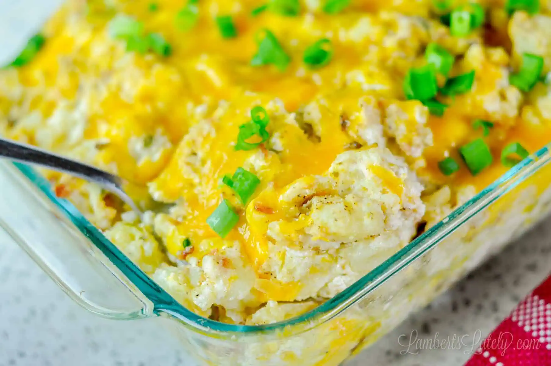close up of a spoon in the twice baked mashed potatoes.