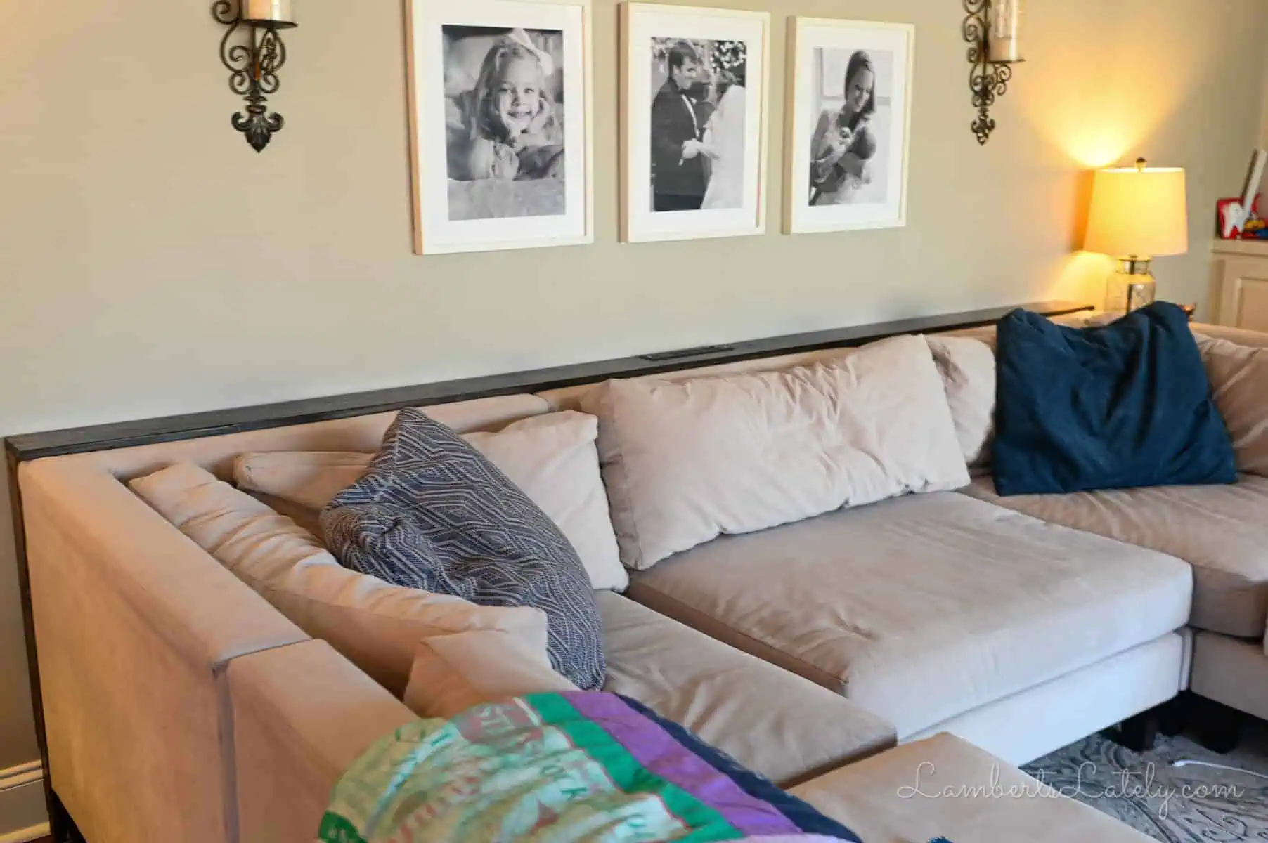 sofa table behind a large sectional couch.