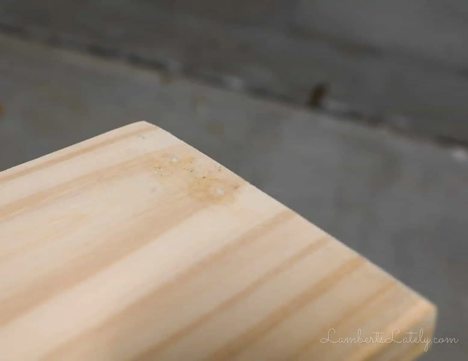 nail holes filled on a wood table.
