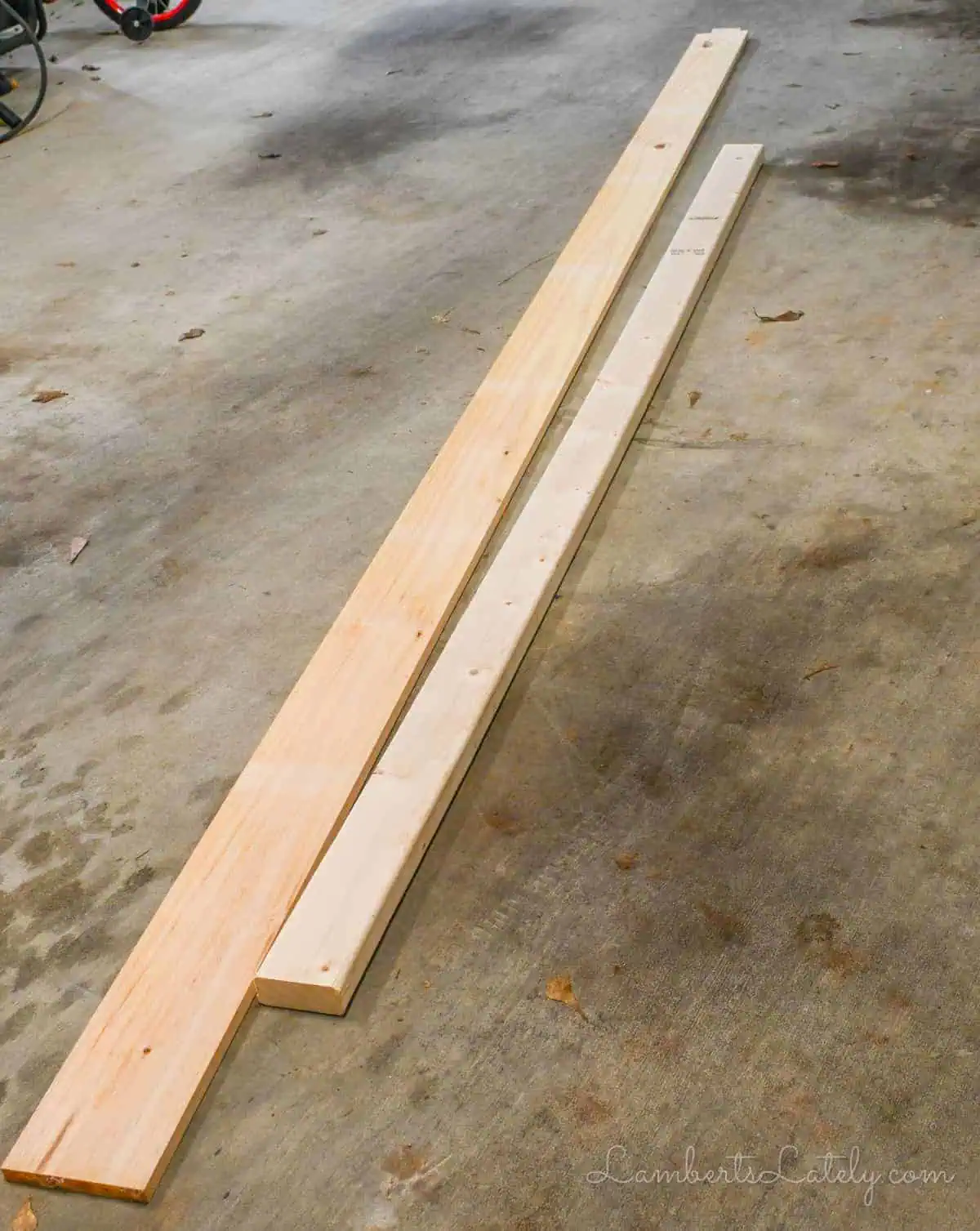 1x6 and 2x4 on a garage floor.