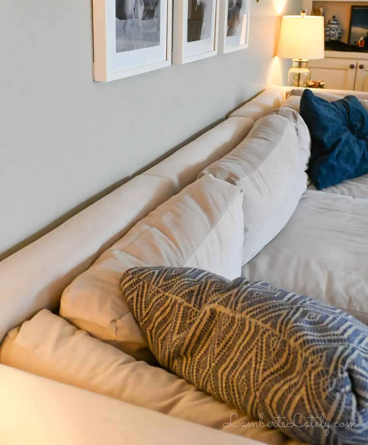 back of a cream-colored couch against the wall.