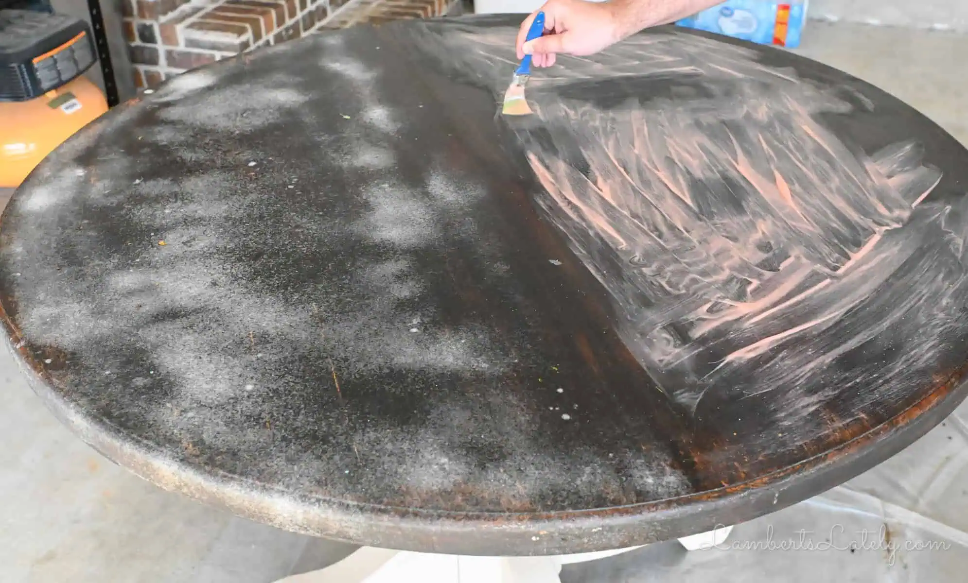 oven cleaner on one half of a wood table, stripping gel on the other half.