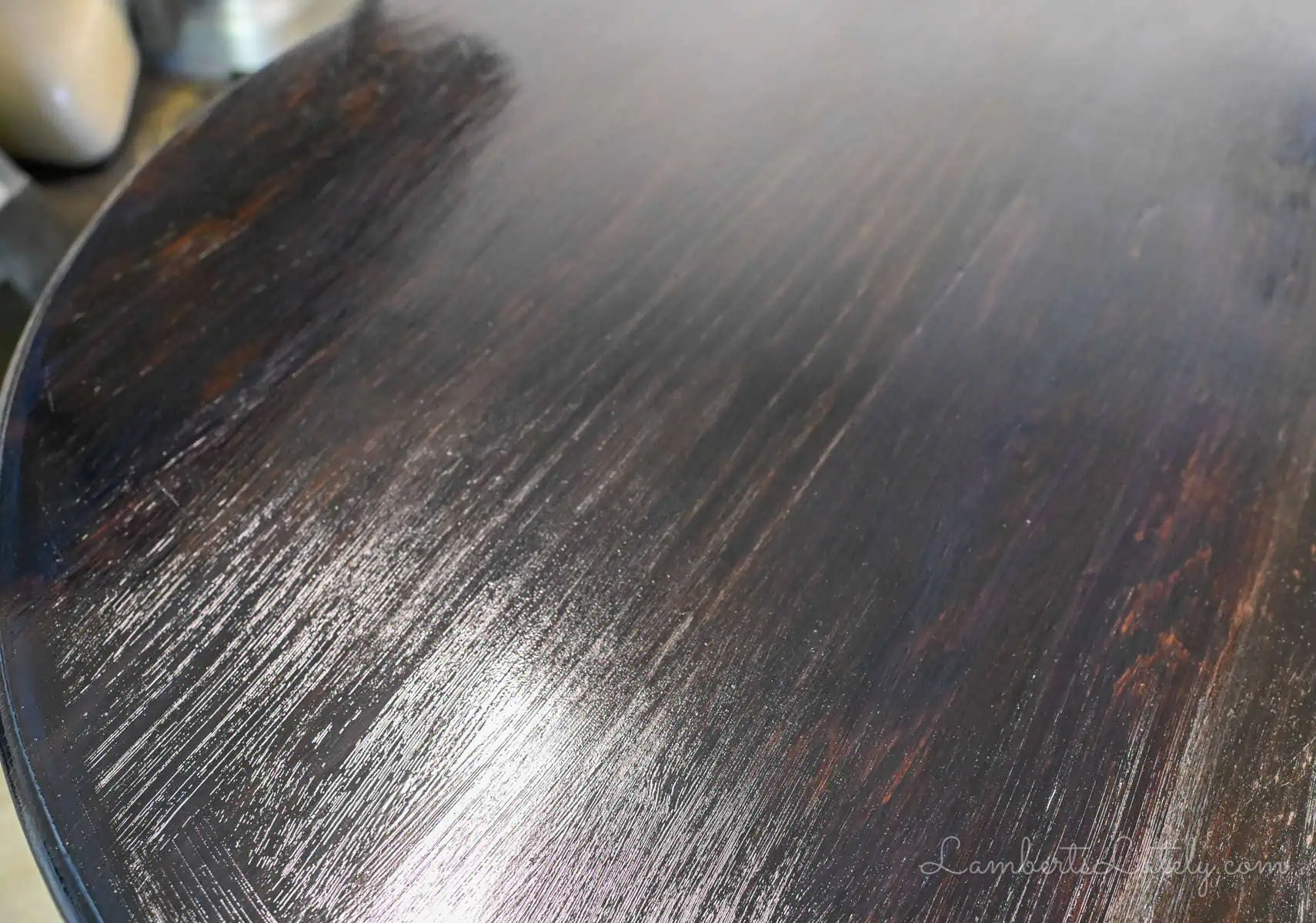 coat of wet polyurethane on a table.