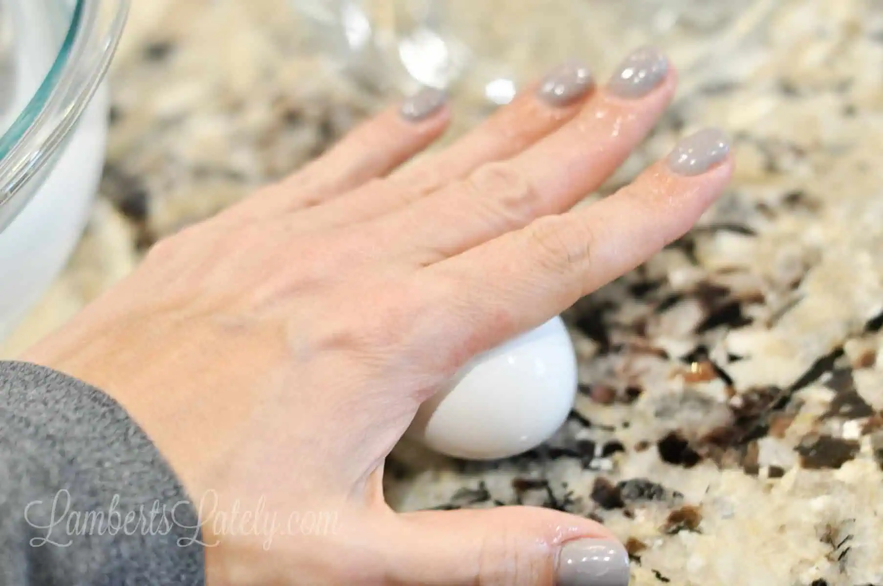 rolling a cooked egg on a counter.