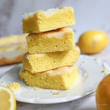 stack of lemon brownies on a plate.