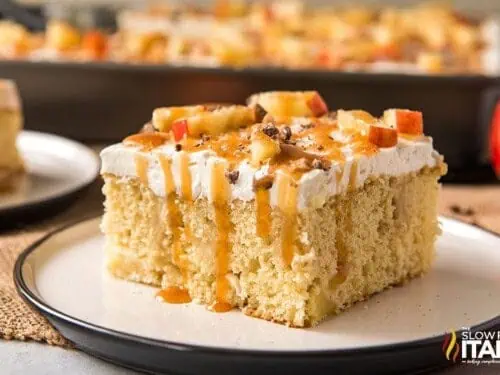slice of caramel apple poke cake on a plate.