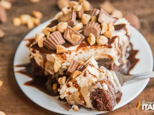 chocolate peanut butter poke cake on a plate.