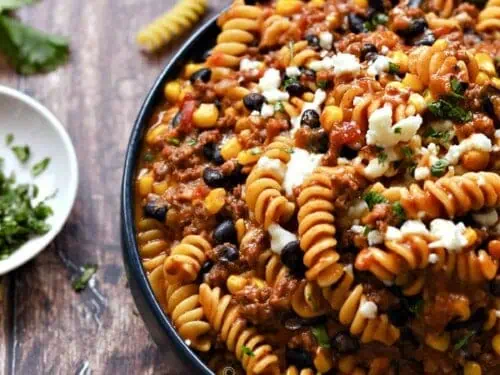 bowl of taco pasta with corkscrew noodles.