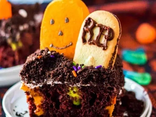 Graveyard cake slice on a plate.