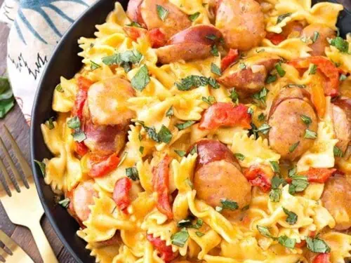 cajun pasta in a bowl on top of a cloth napkin.