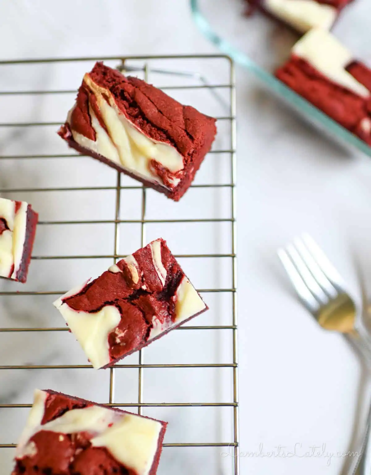 red velvet brownies on a cooling rack.