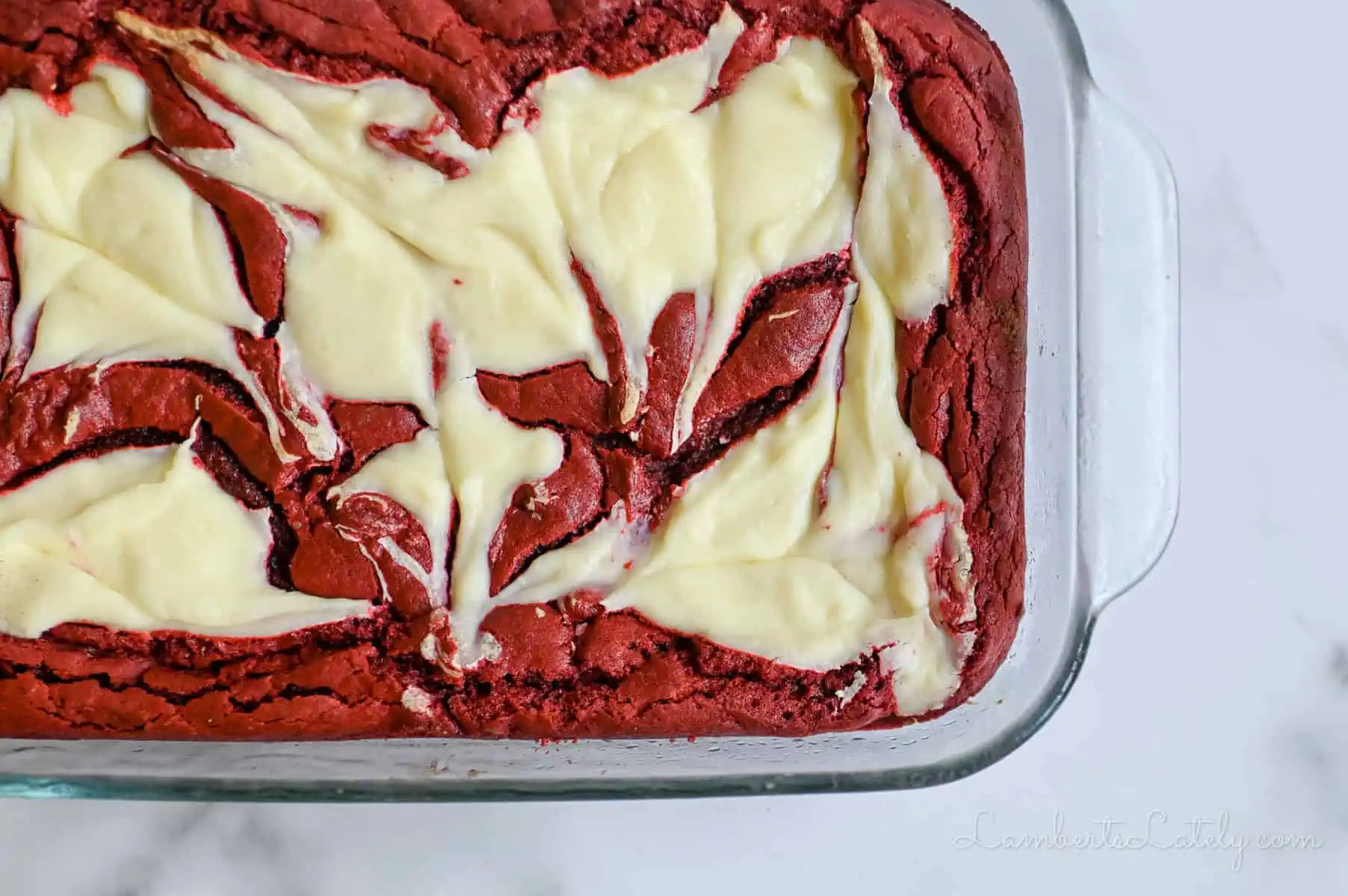 baked red velvet brownies in a baking dish.