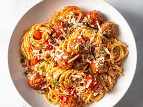 spaghetti and meatballs in a bowl.