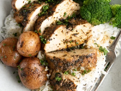 chicken, broccoli, potatoes, and rice on a plate.
