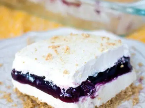 blueberry lush dessert serving on a plate.