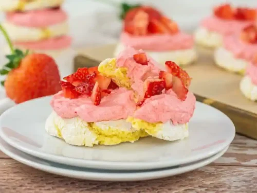 strawberry lemonade cookies stacked on a plate.