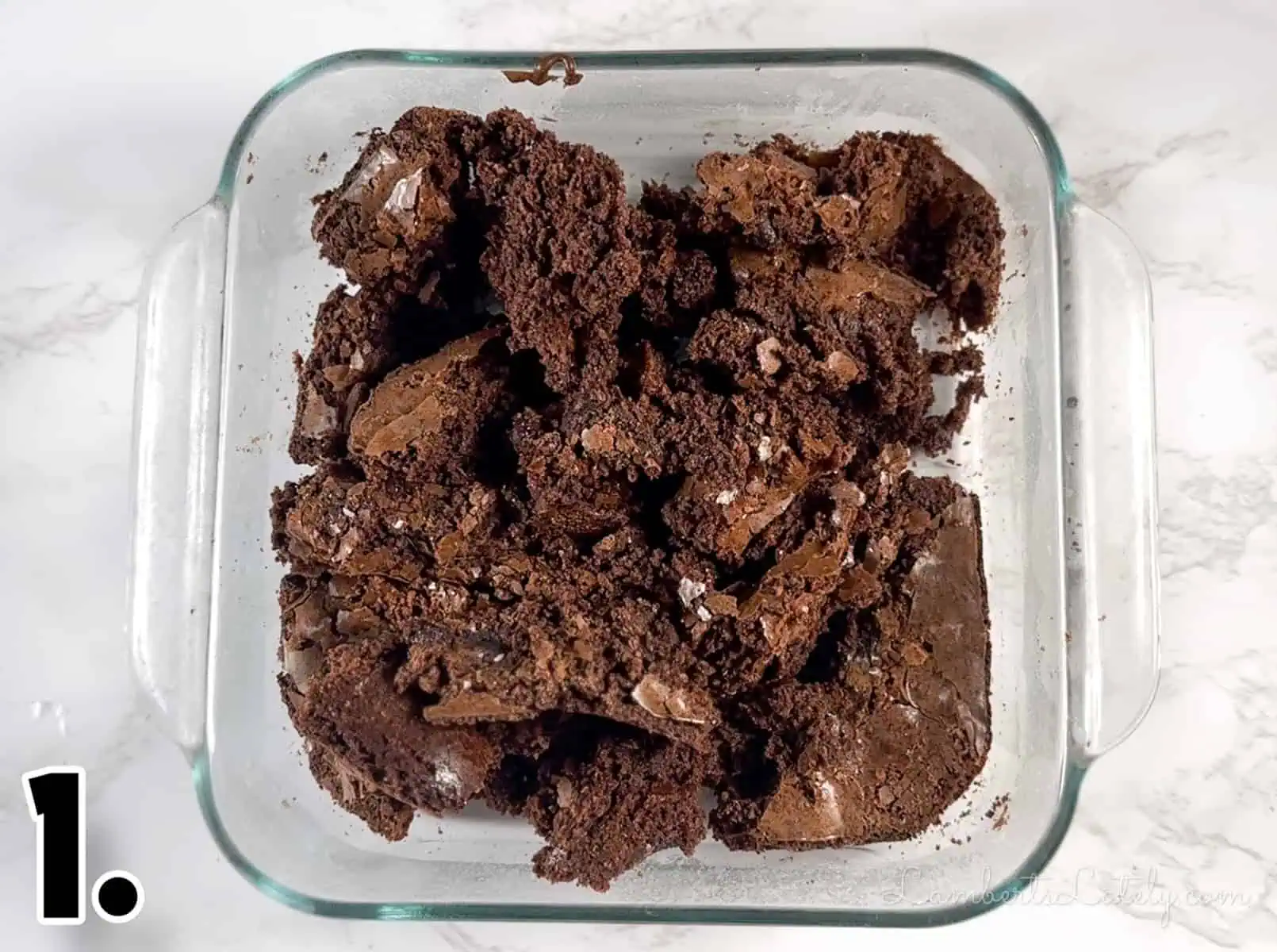 crumbled brownies in a baking dish.