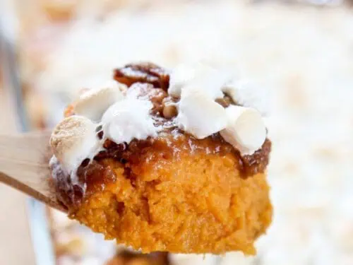 spoonful of sweet potatoes covered in marshmallows.