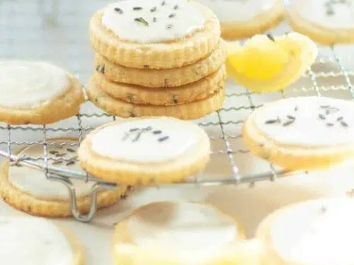 stacks of lemon lavender cookies on a baking rack.