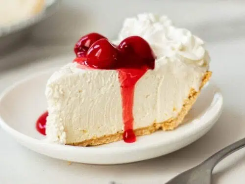 no-bake cheesecake covered in strawberry sauce.