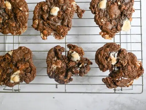 rocky road cookies on a baking rack.