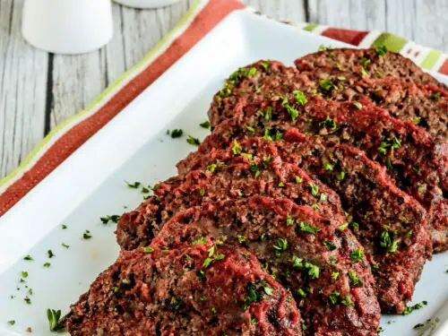italian meatloaf sliced on a serving platter.