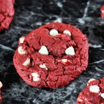 red velvet cookie on a black counter.