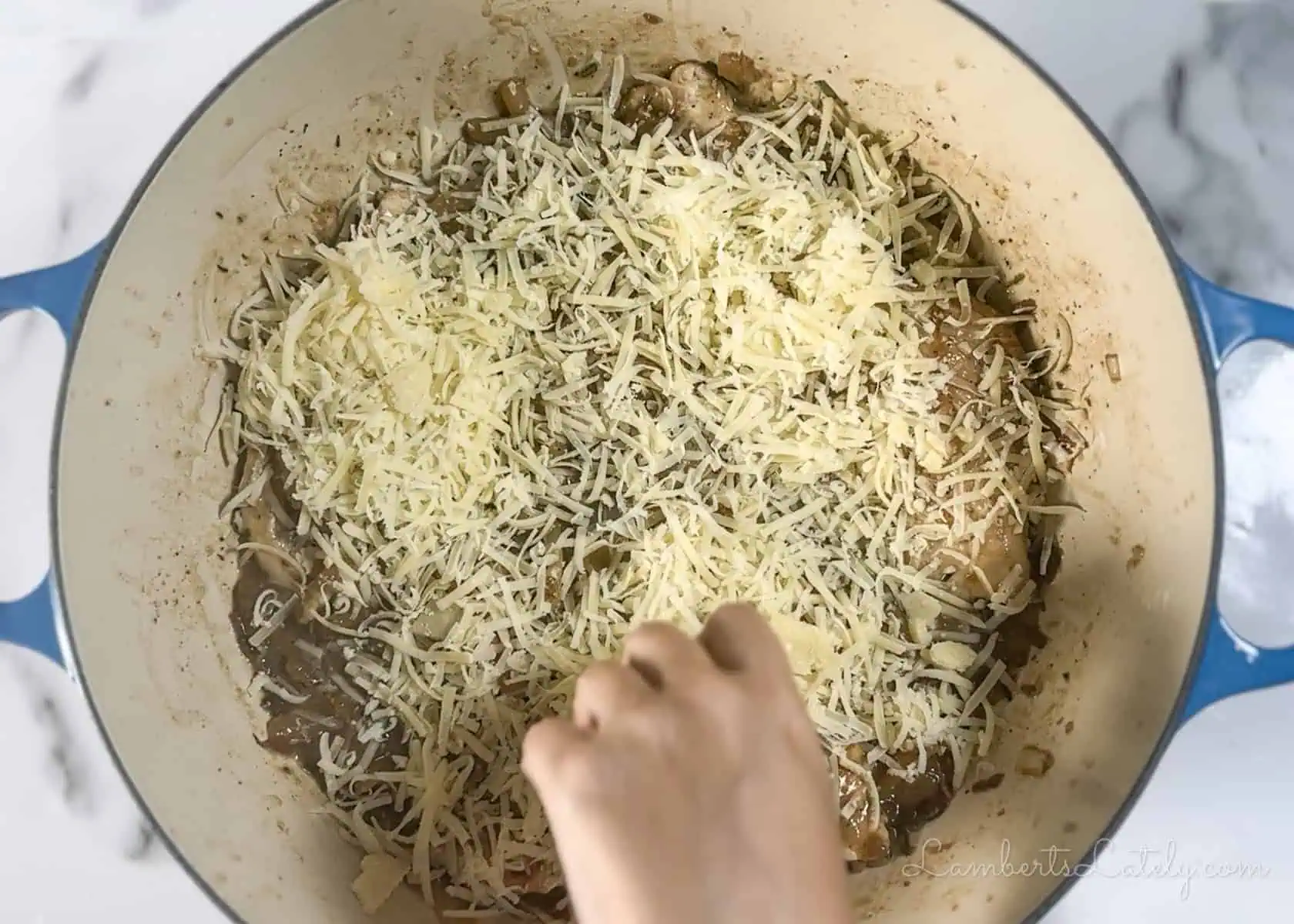 topping french onion chicken bake with gruyere cheese.