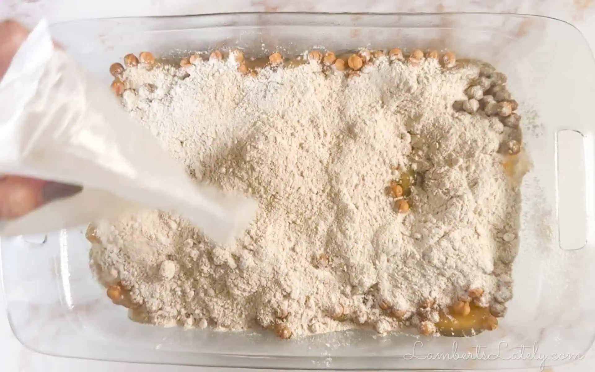 spice cake mix poured into baking dish.