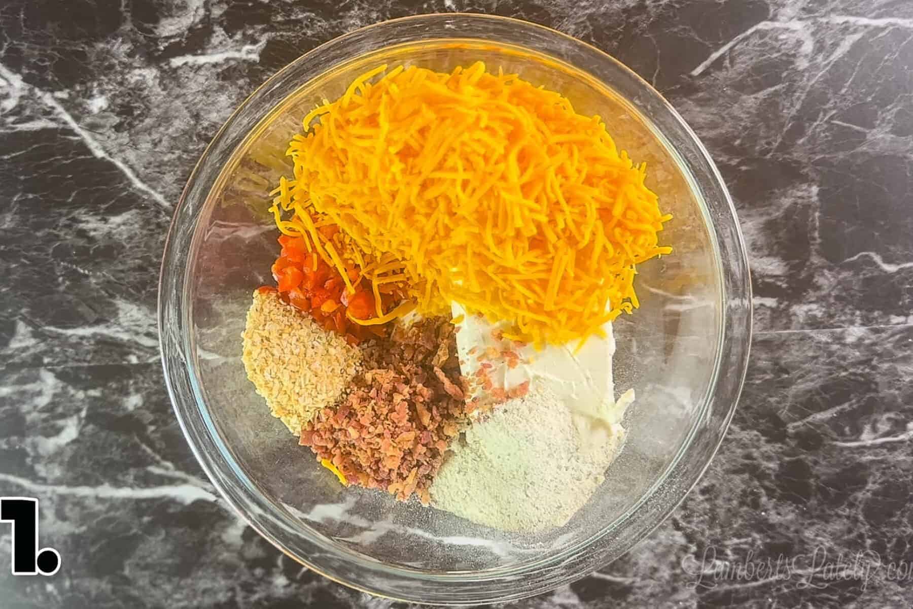 cheese ball ingredients in a glass bowl.